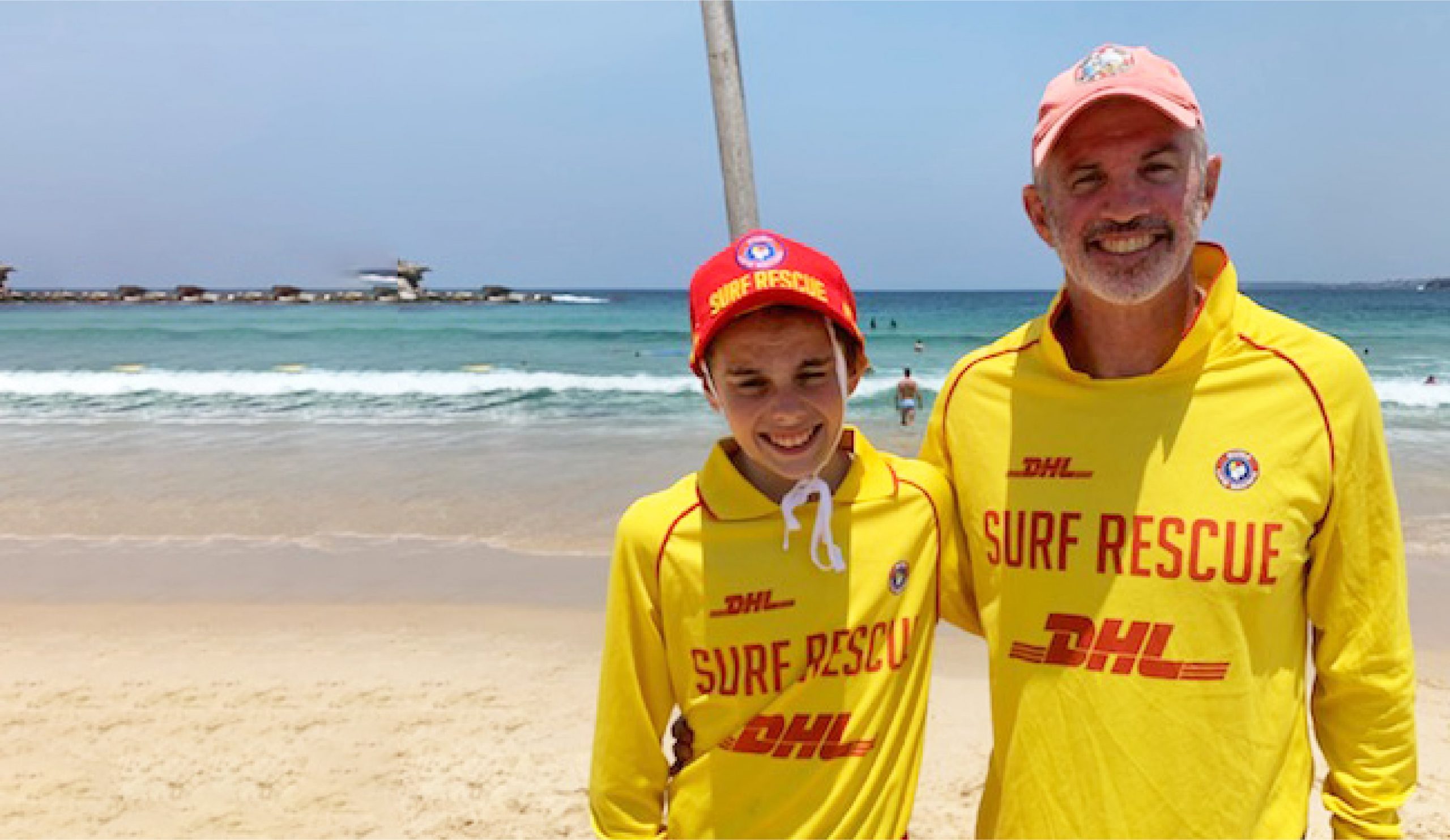 Volunteer surf lifesavers Joe Porteus and his son, Campbell on patrol at North Bondi Beach.